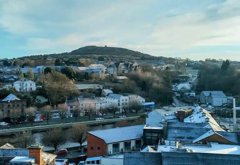 Scenic aerial view of Enniscorthy town on a frosty day with the River Slaney in the foreground and Vinegar Hill rising in the background.