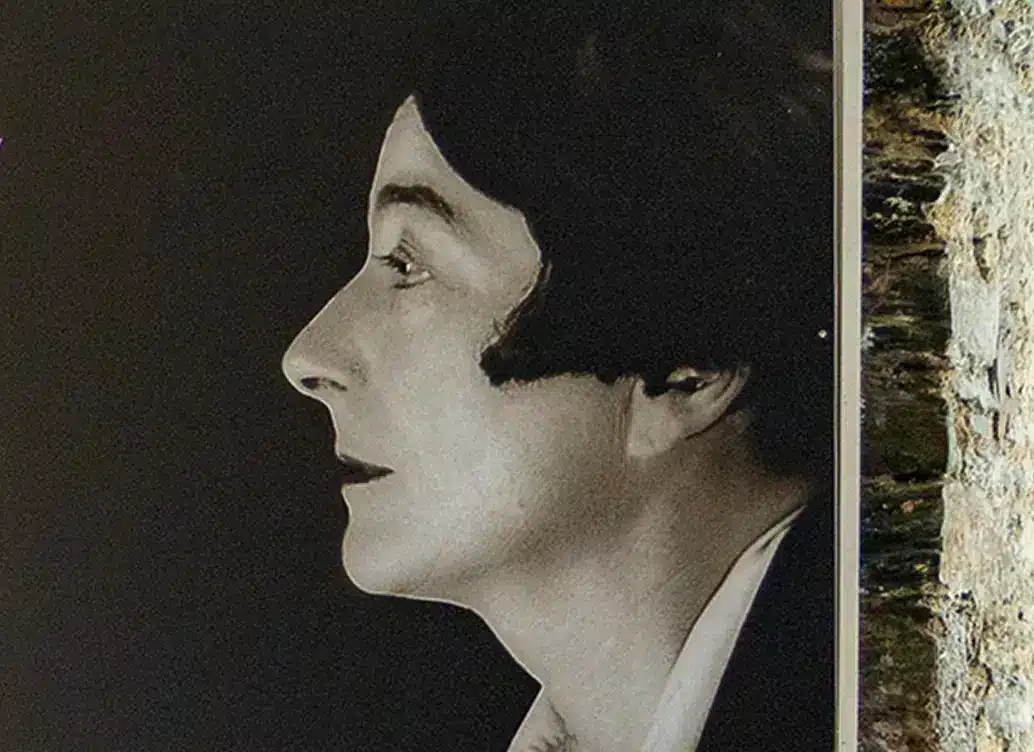 Black and white side-profile portrait photograph of Eileen Gray against a dark background, featured in Enniscorthy Castle.