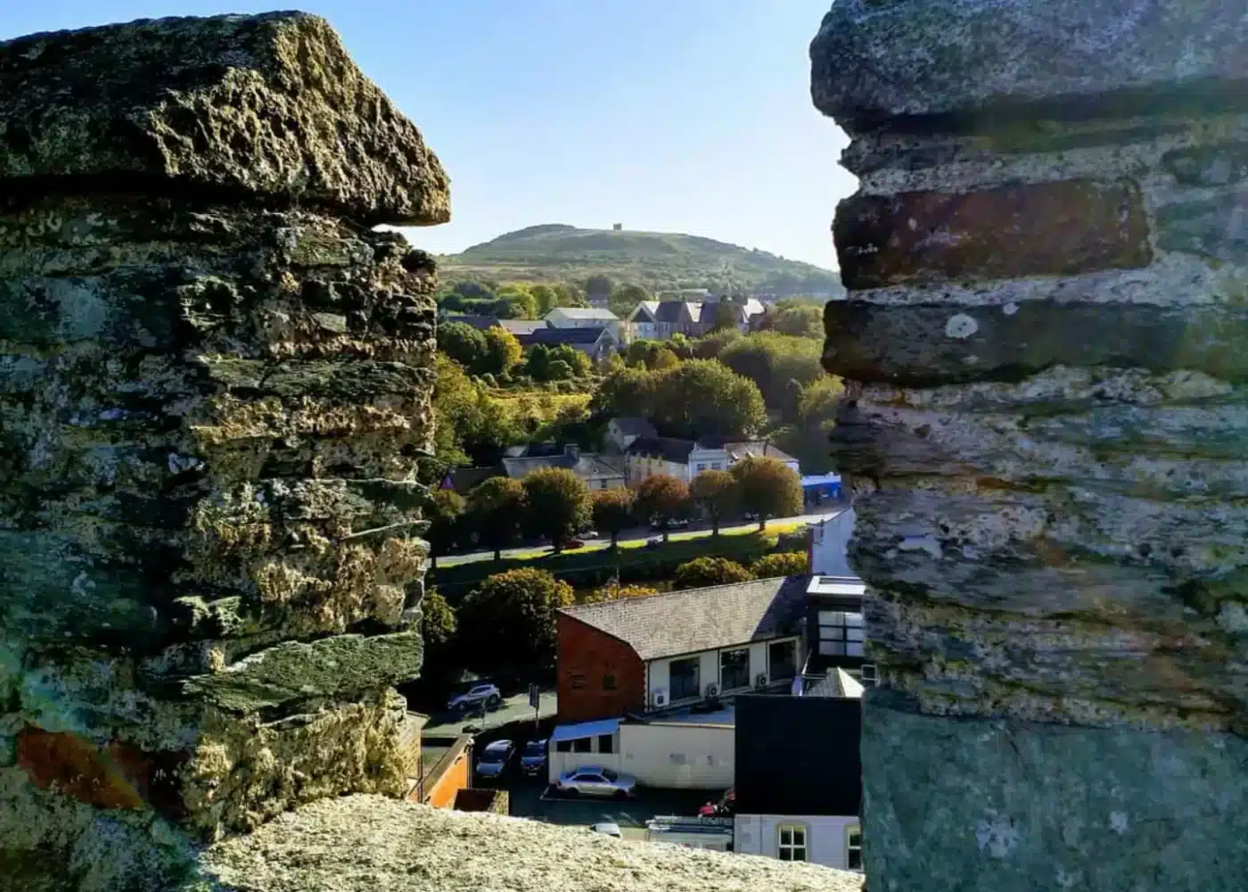 View of Enniscorthy town and Vinegar Hill seen through the stone battlements of Enniscorthy Castle.